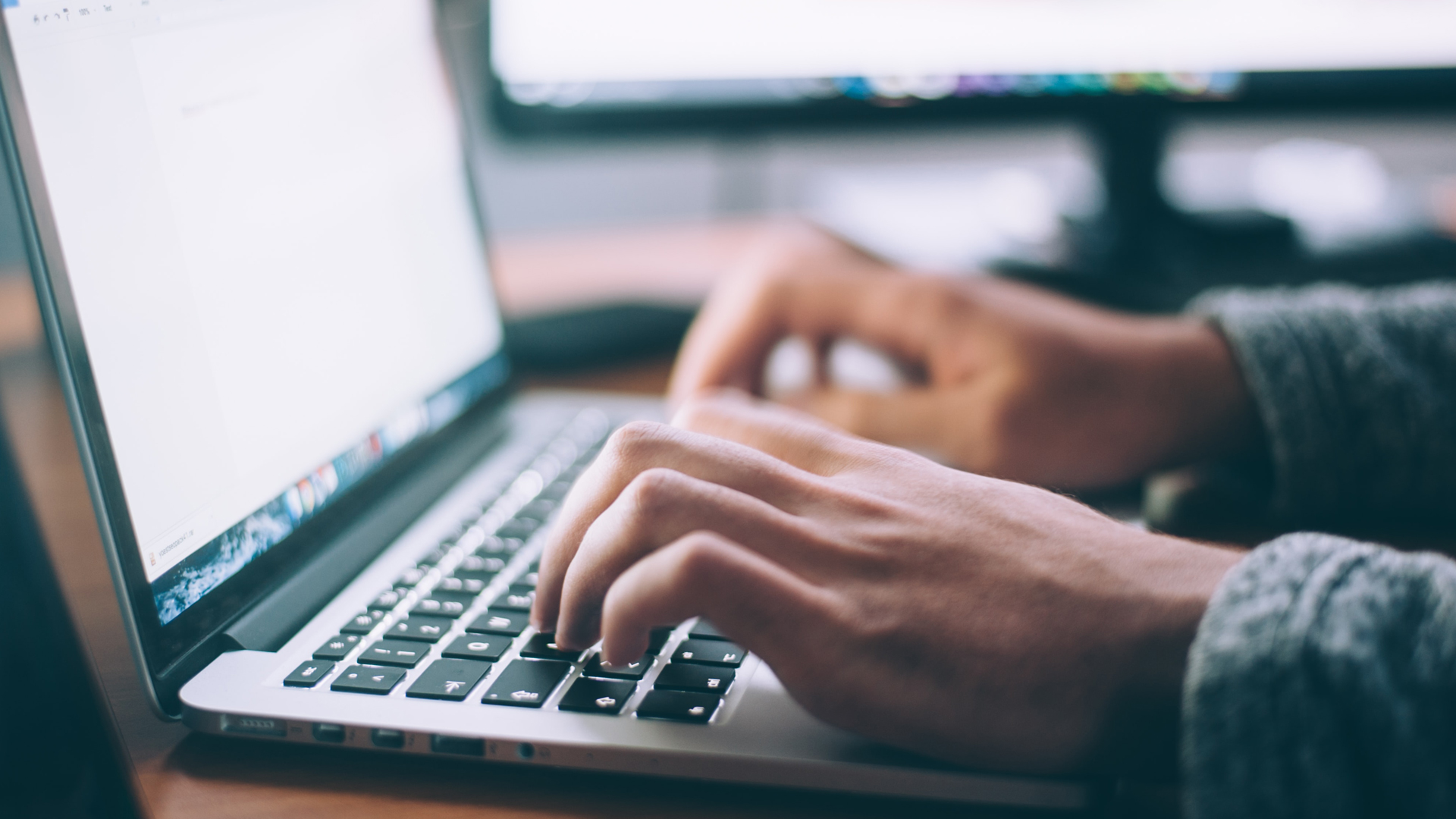 Close up of a man using a laptop